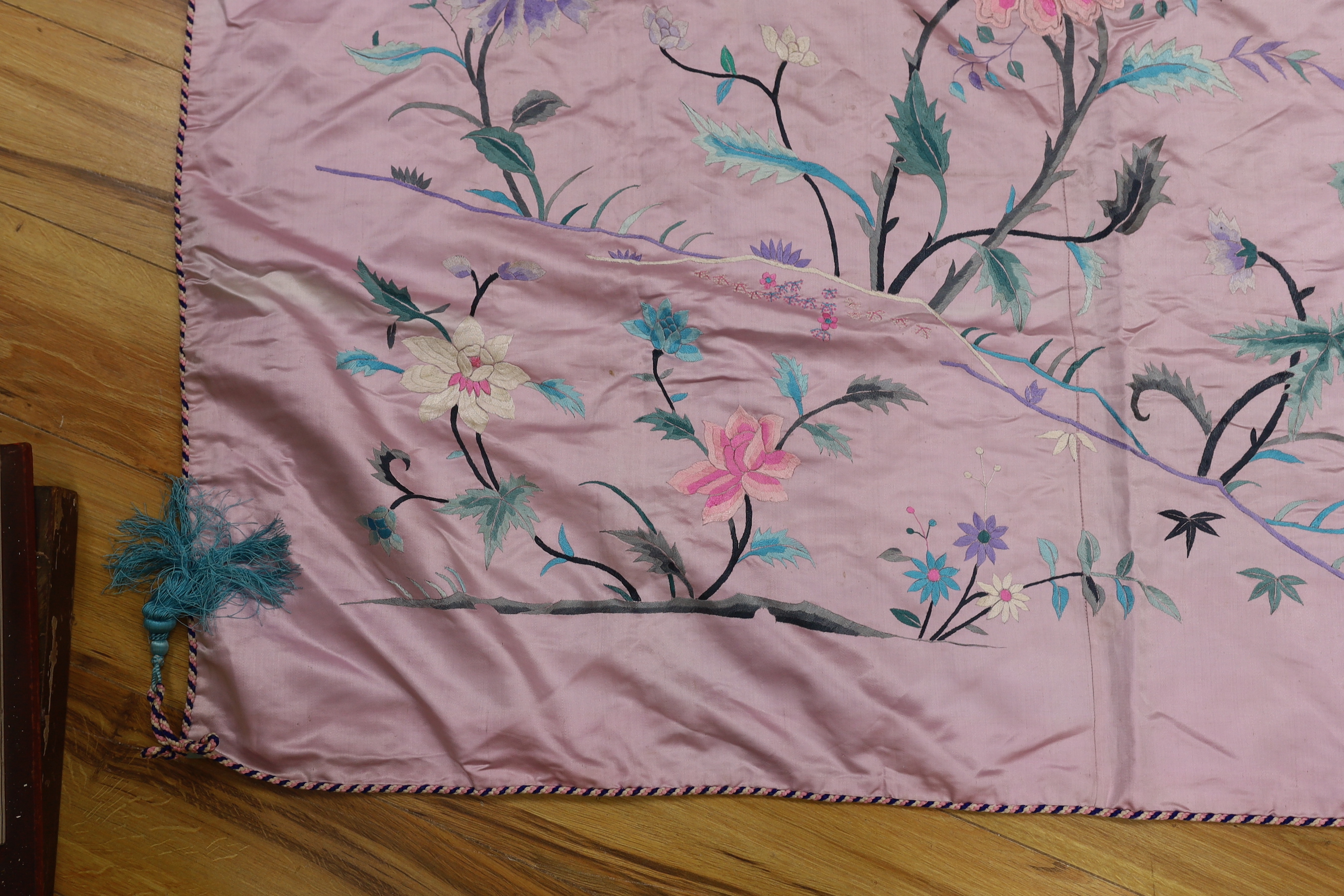 An Oriental mauve ground embroidered silk shawl